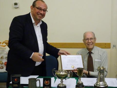 Ian Comley presenting Life Membership to John  Cannon