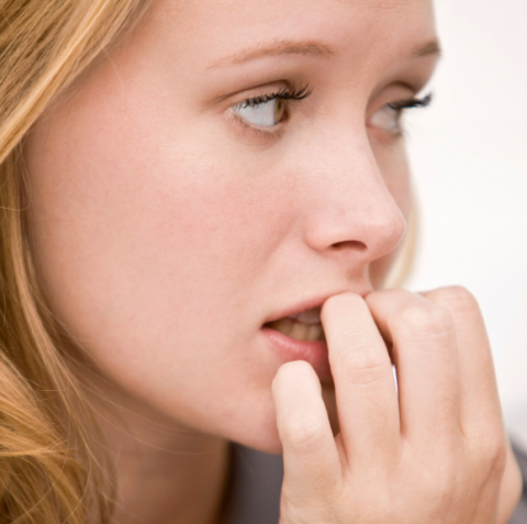 Lady biting nails